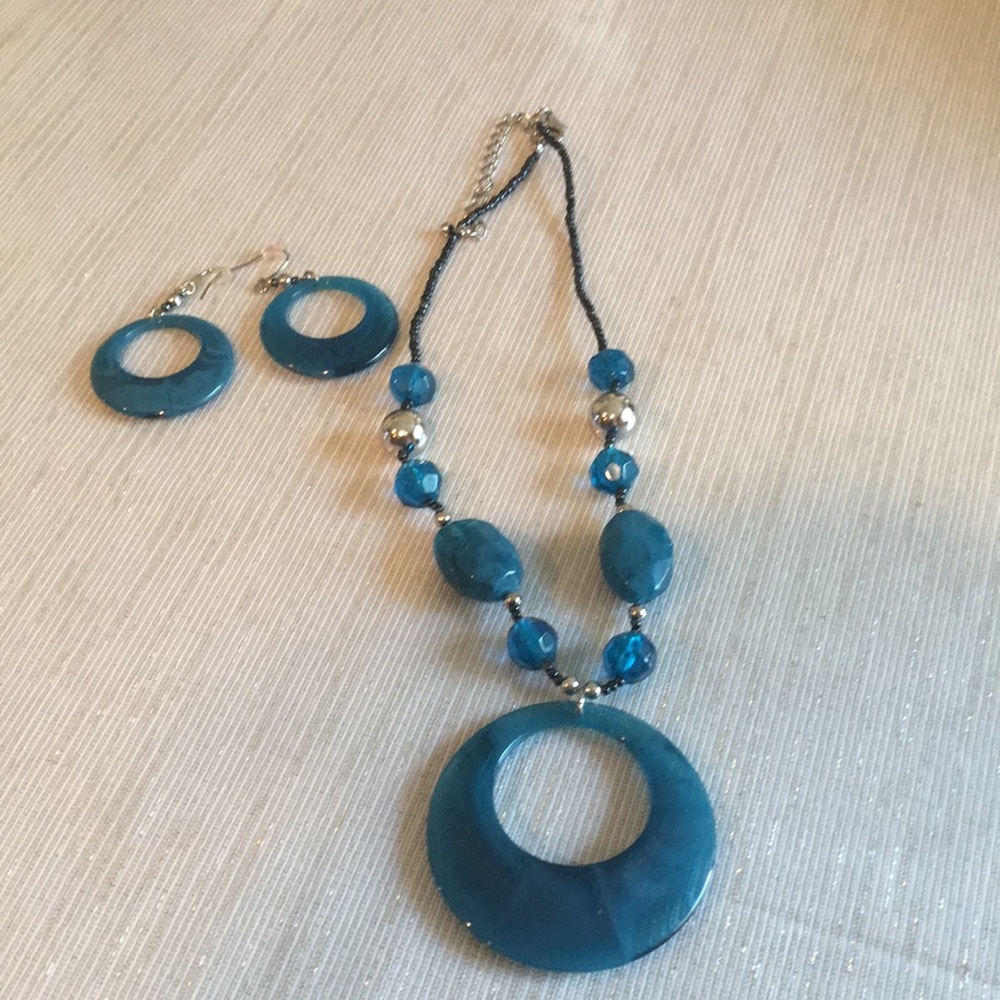 Charming Charlie’s teal necklace and earrings.